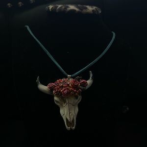 Steer with roses necklace